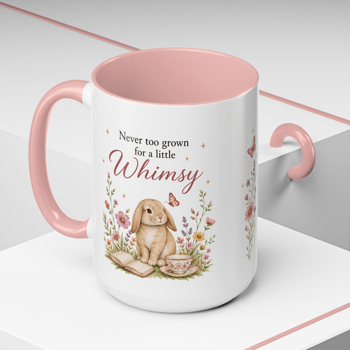 Never Too Grown for Whimsy mug displayed on a cozy reading nook shelf