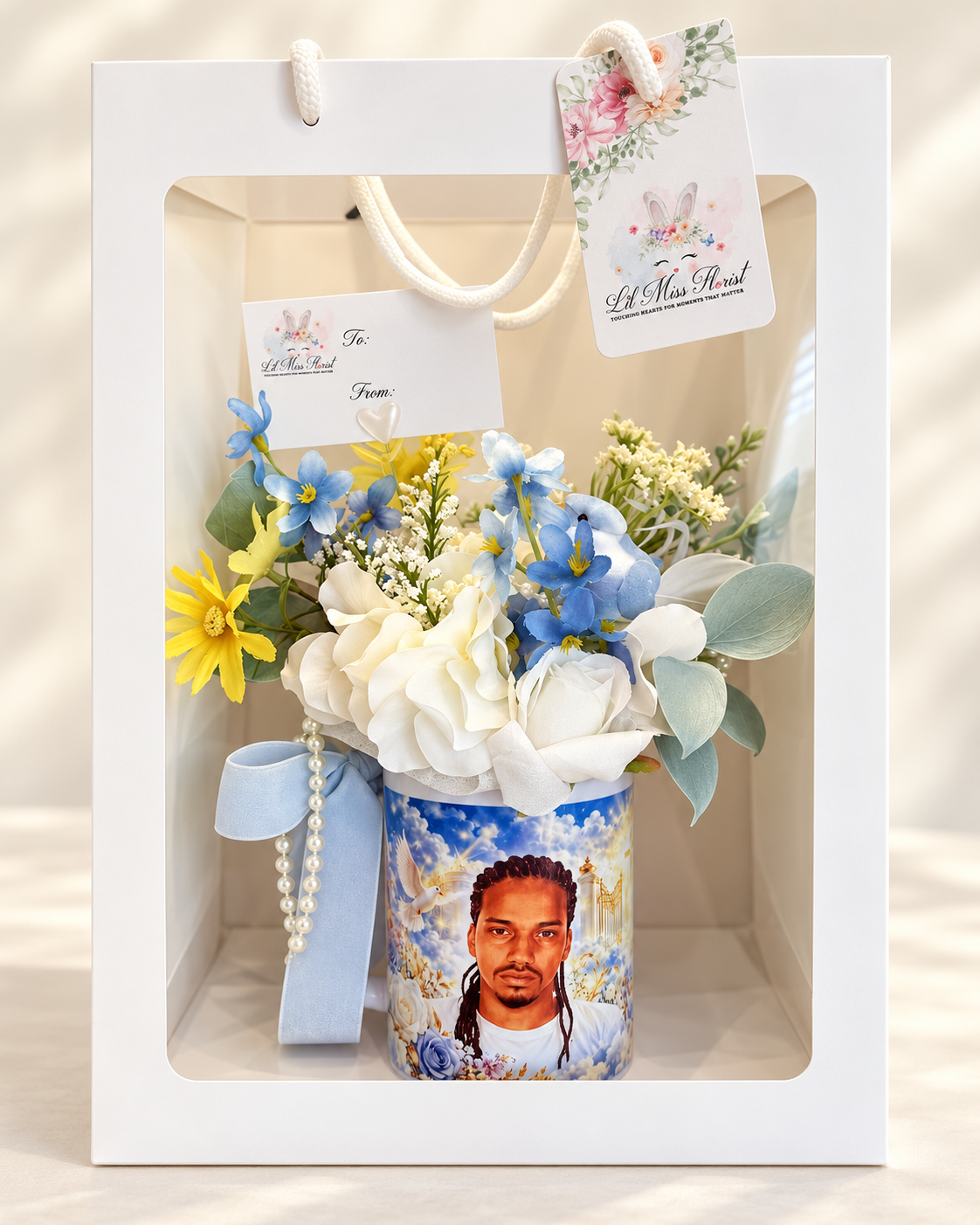 Memorial Bloom Mug floral arrangement presented in a Lil Miss Florist window gift bag